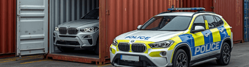 Website Thumbnail AI image police car with recovered vehicle in container 360px by 164px