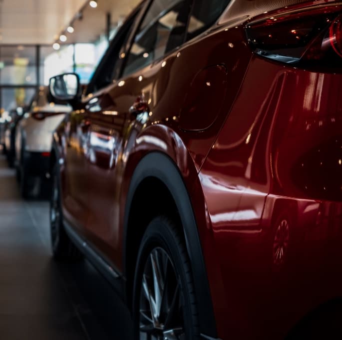 Canva AI images   Dealership cars in showroom Dark Fade Applied Image1v2 website